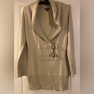 Le Chateau sweater with classic buckle detail.